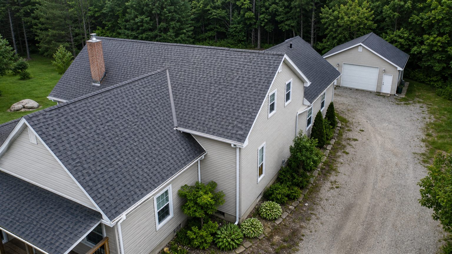 Aerial view of a roof and property exterior
